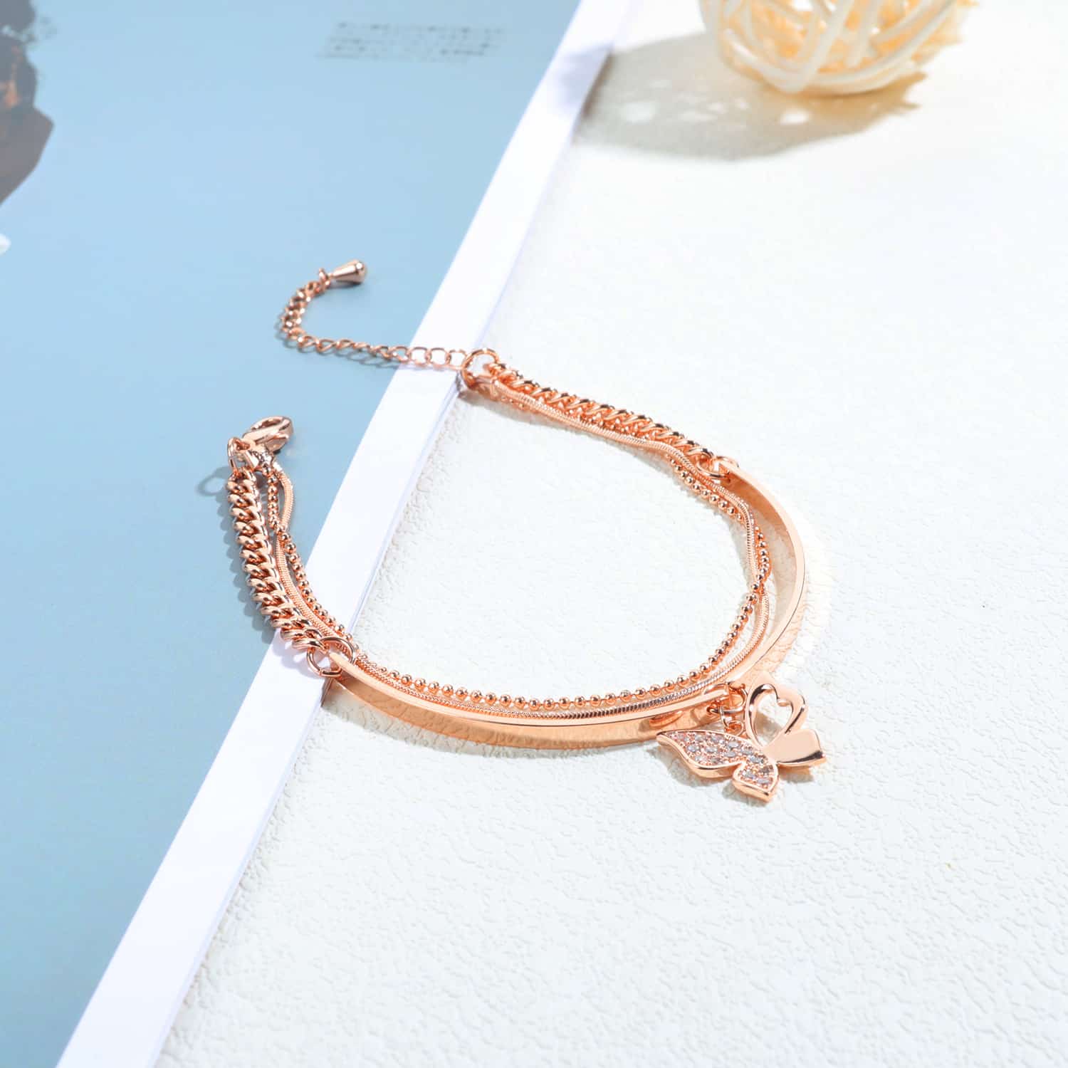 Sophisticated Rose Gold Bracelet with Charming Butterfly Detailing