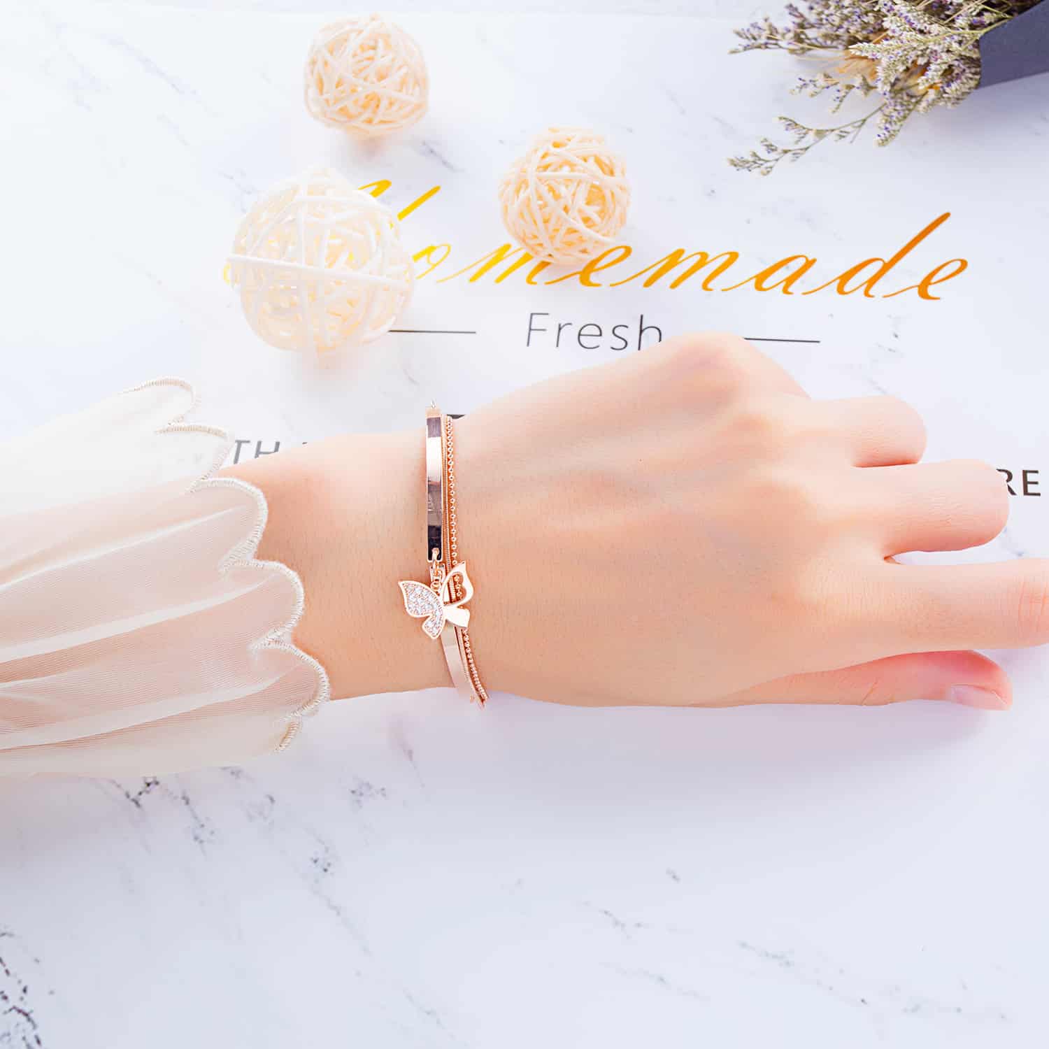 Sophisticated Rose Gold Bracelet with Charming Butterfly Detailing
