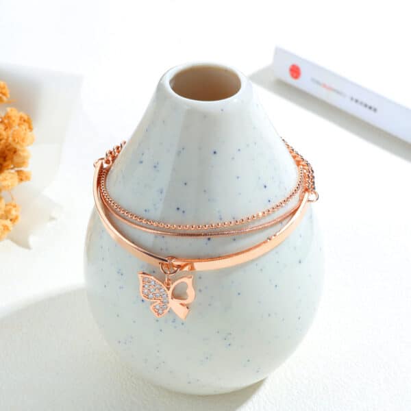 Sophisticated Rose Gold Bracelet with Charming Butterfly Detailing - Image 2