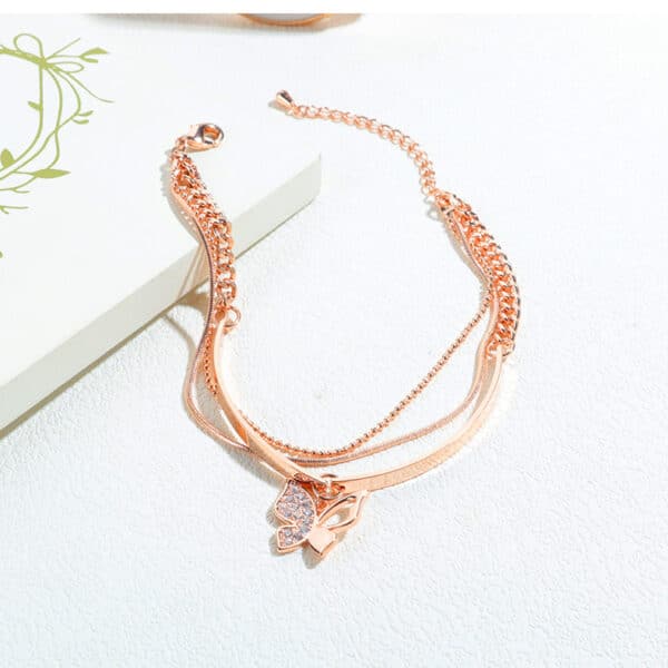 Sophisticated Rose Gold Bracelet with Charming Butterfly Detailing - Image 4